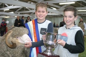 Harry Miller, left, with his supreme Merino exhibit Hazza, and top junior handler at the Ballarat show, Alex Russell.