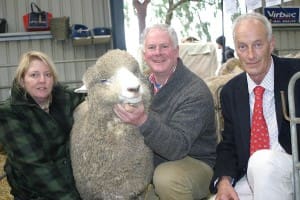 Blackwood Performance Corriedale principals Claire and Peter Blackwood, with the $2000 ram they sold to Jim Sidey, at right, at the Sheepvention sale.