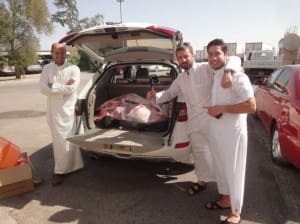 Bahraini Eid customers load up their sheep carcases