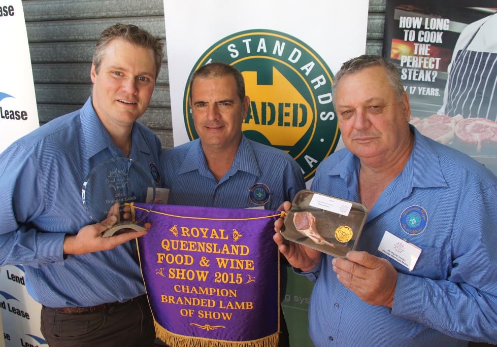 Melrose Wholesale Meats ' Dominick Melrose and Wayne Young collect the champion branded lamb award on Friday. 