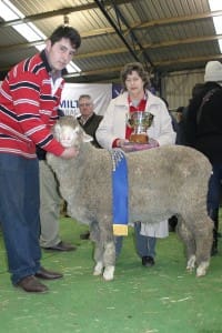 Oakbank Merino stud's Jack McRae is presented with the inaugural Stuart Cuming trophy by Lavinia Cuming at Sheepvention.