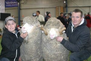 Glenpaen Merino Stud's Harry Miller, left, with the grand champion Merino ewe at Sheepvention and Luke Walton from the Wurrook stud with the grand champion ram.