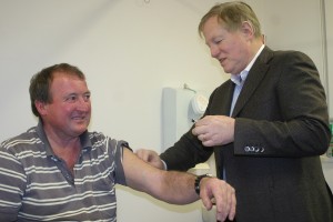 Hamilton's Dr Dale Ford gives Casterton livestock carrier Mick Smith his Q Fever vaccination.