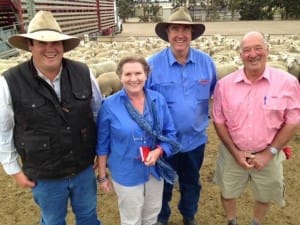 Owen McClure with his parents Jane and Gordon, and Elders agent Ian Button at the Hamilton saleyards on Wednesday.