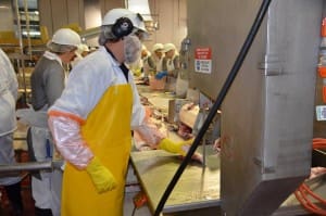 Southern Meats employee Kent McDonald operating a BladeStop bandsaw.