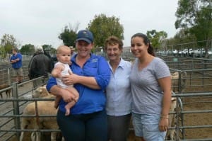 At the OPuyen sheep and lamb sale this week were, from left, Samara Pohlner holding Mallie Gallow, Joan Pohlner and Renae Galloway.