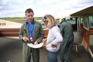 Aerial baiting pilot Cracker, left, with senior Western LLS biosecurity officer Robynne Wells-Budd at the Cobar airstrip.