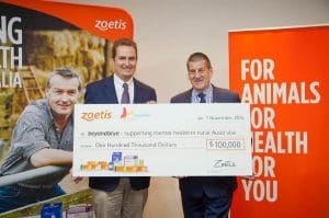 Zoetis general manager Lance Williams hands over the $100,000 cheque to beyondblue chairman Jeff Kennett.